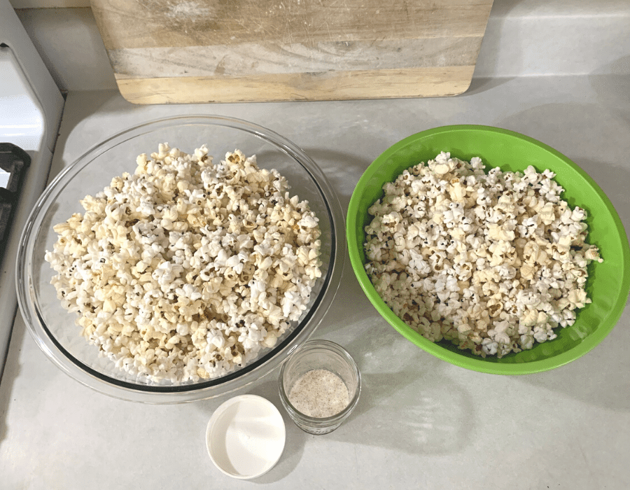 Popcorn in two large bowls on the counter.