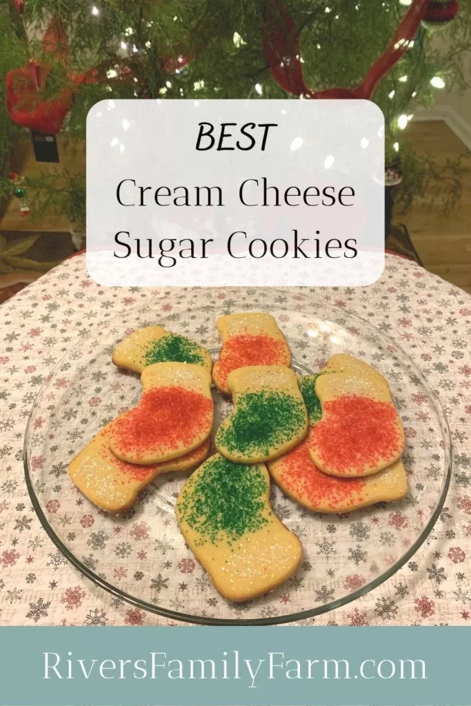 Red and green cream cheese sugar cookies in the shape of Christmas stockings.