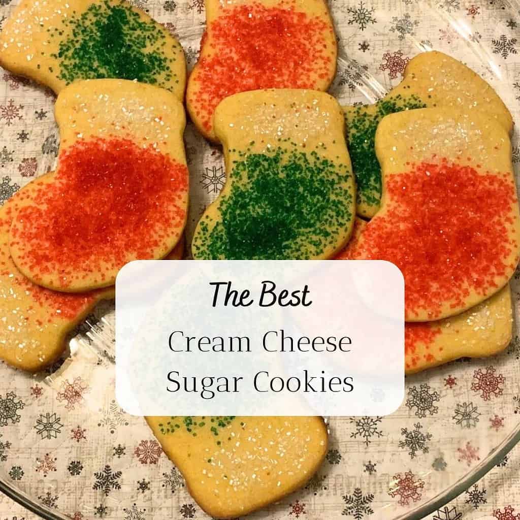 Red and green cream cheese sugar cookies in the shape of Christmas stockings. The title is "The Best Cream Cheese Sugar Cookies."