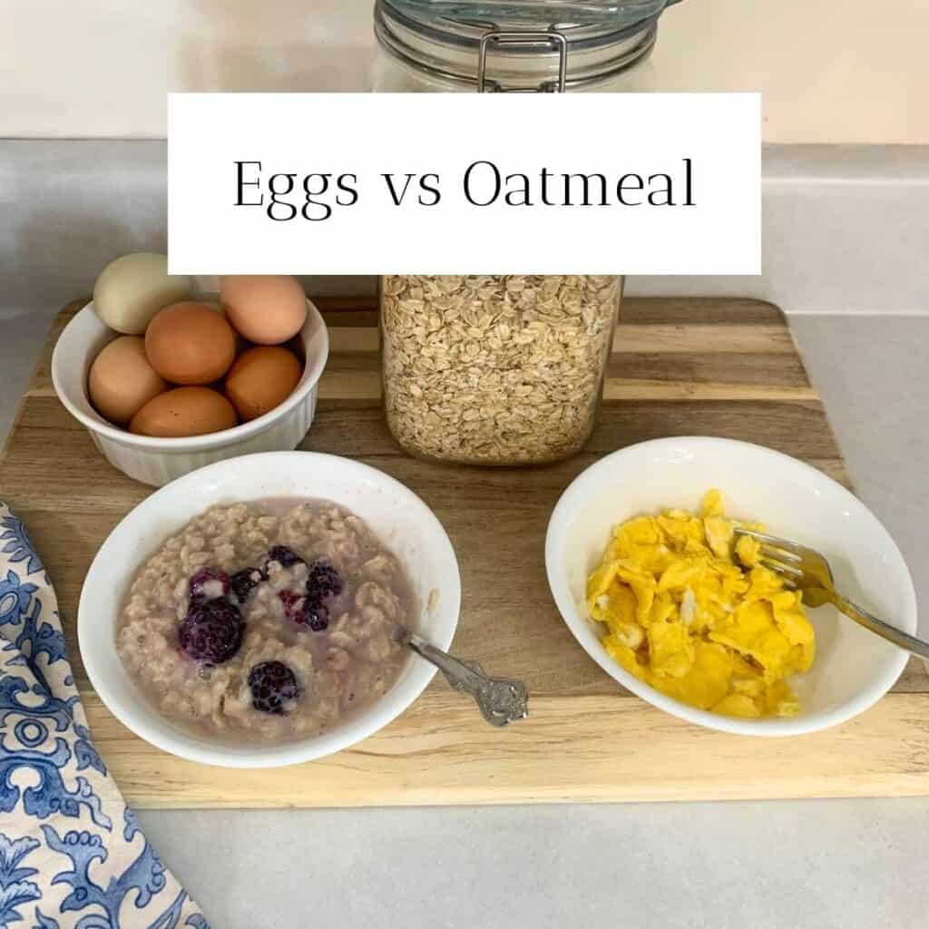 A white bowl with brown and green eggs inside next to a half-gallon glass jar of rolled oats sitting on a wooden cutting board. In front are two white bowls, one with cooked oatmeal with blackberries on top and another bowl with cooked yellow eggs.