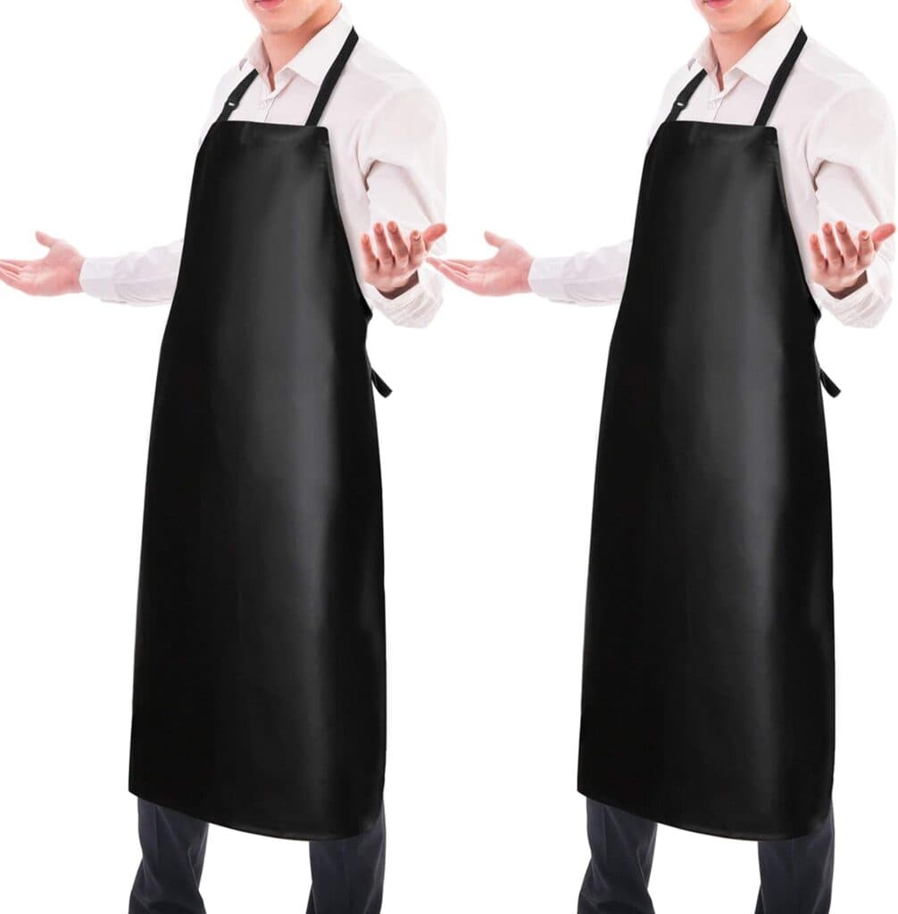 Two black vinyl aprons for shop or evisceration.