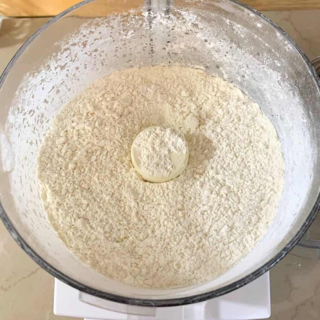 A food processor filled with self-rising flour.