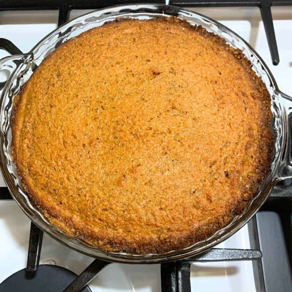 Cooked low sugar carrot pie sitting on a gas stove.