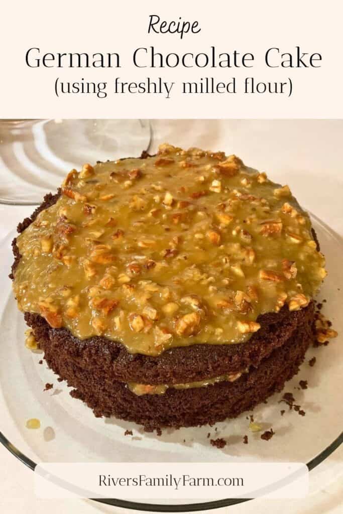 A two layer German chocolate cake with pecan and coconut icing on a glass cake plate. The title is "Recipe German Chocolate Cake using freshly milled flour" by Rivers Family Farm.